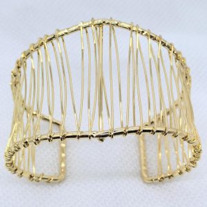Architectural gold wire cuff bracelet with a structured, sculptural design. | Lemme Buy